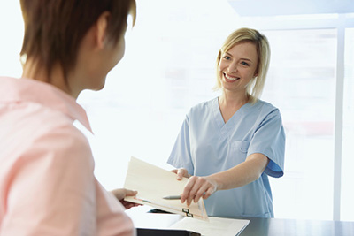 Receptionist hands over documents