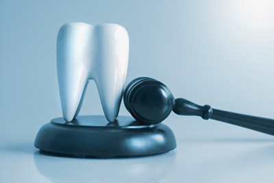 Model of a Tooth and judge's gavel